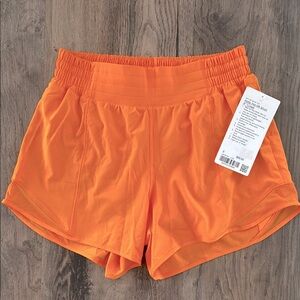 NWT! Lulu Hottie Hot 4” lined in LIT ORANGE.